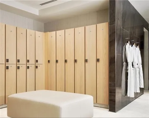 a bedroom with a bed a rug and a large mirror