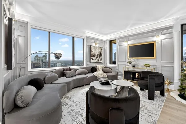 a living room with furniture and a flat screen tv