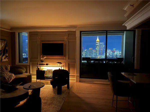 a living room with fireplace furniture and a flat screen tv