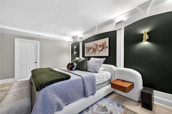 a bedroom with bed and window