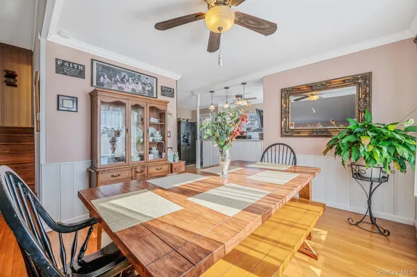 a work room with furniture and potted plant
