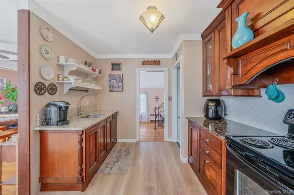 a kitchen with stainless steel appliances granite countertop a stove and a sink