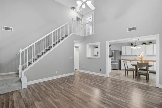 a view of a room with lots of wooden furniture and wooden floor