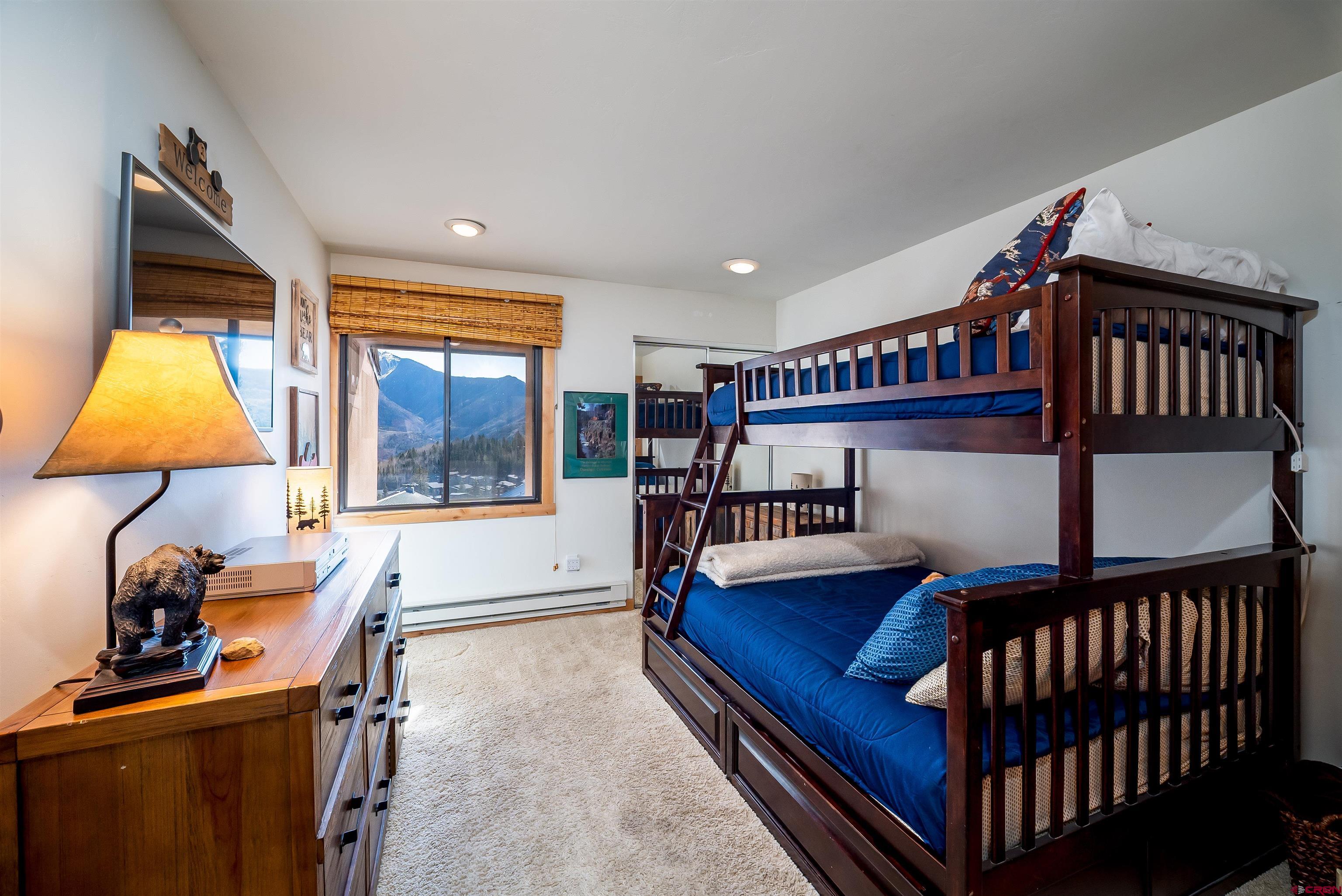 455 Sheol Street, Unit 320 Durango, CO 81301 - Photo 13 of 42 a bedroom with furniture and a window