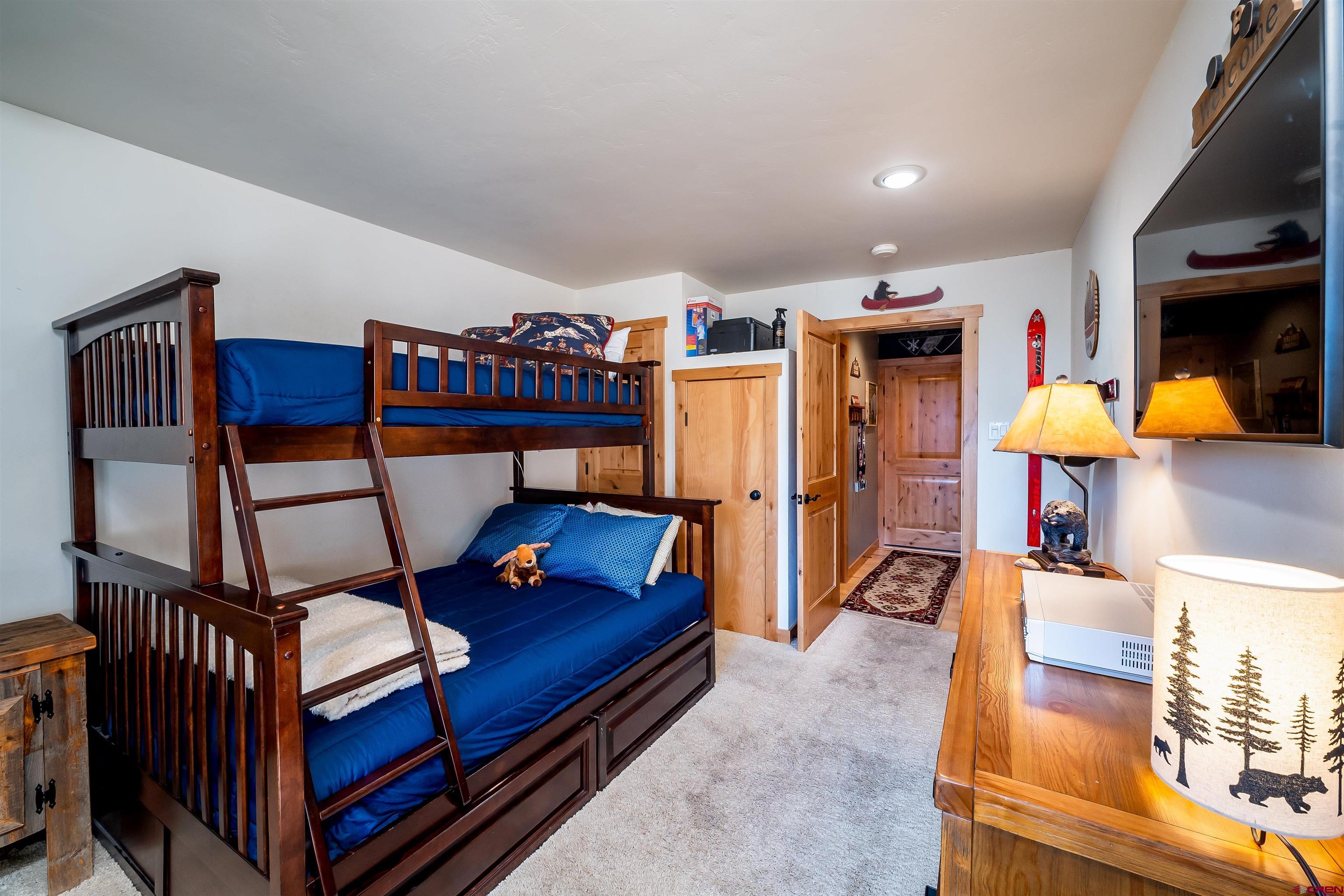 455 Sheol Street, Unit 320 Durango, CO 81301 - Photo 14 of 42 a living room with furniture and a flat screen tv