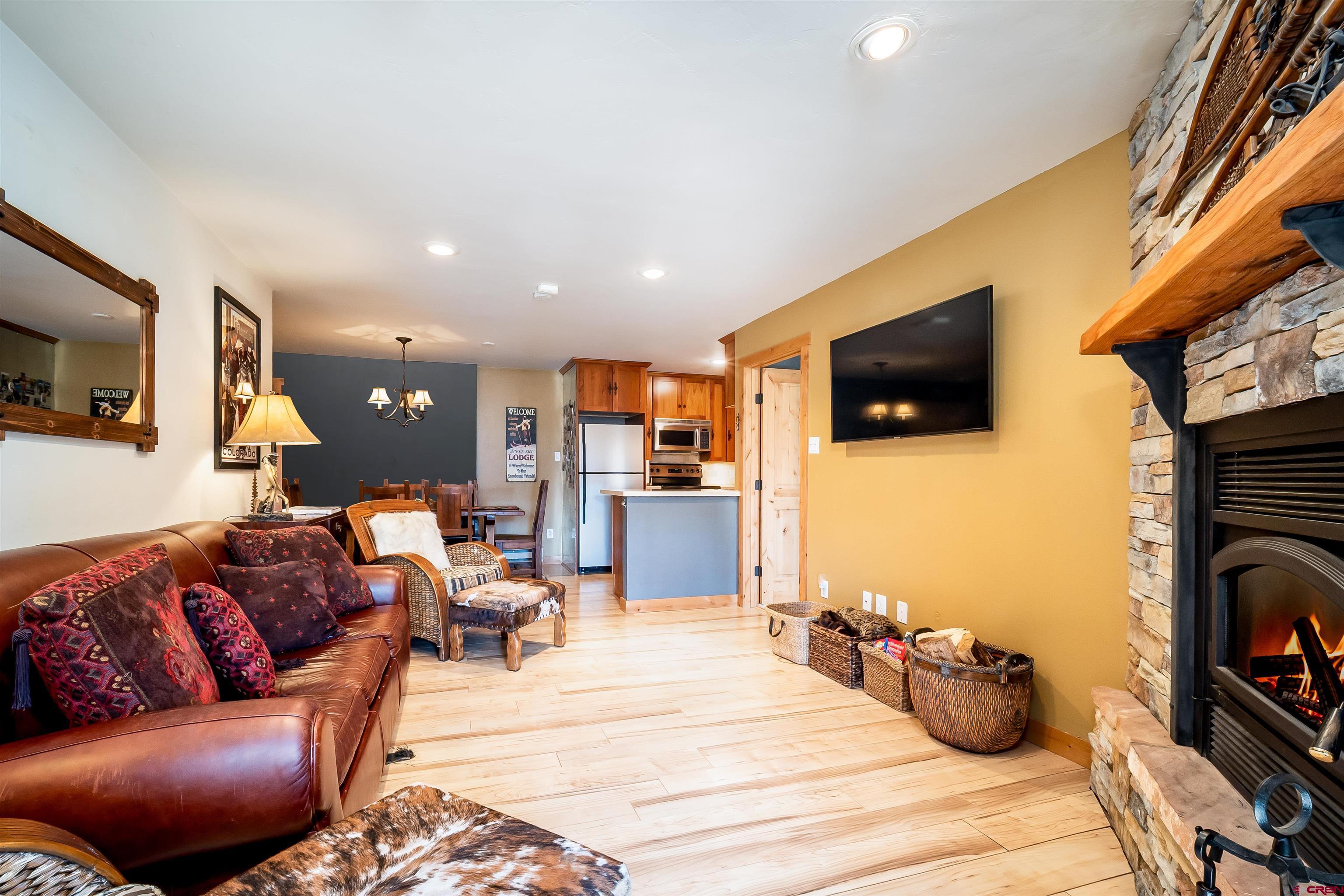 455 Sheol Street, Unit 320 Durango, CO 81301 - Photo 16 of 42 a living room with furniture and a flat screen tv