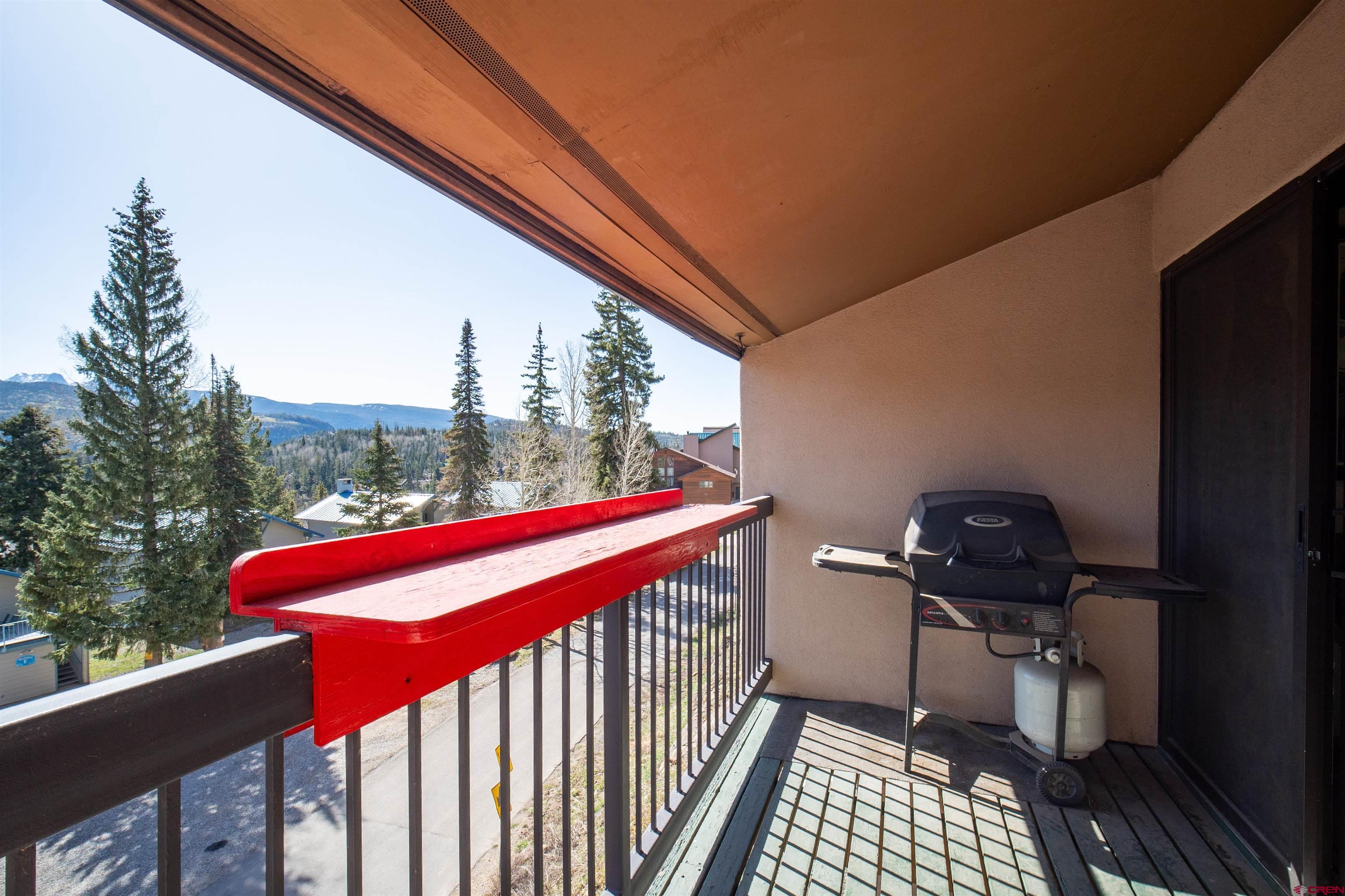455 Sheol Street, Unit 320 Durango, CO 81301 - Photo 20 of 42 a view of a balcony with furniture and wooden floor