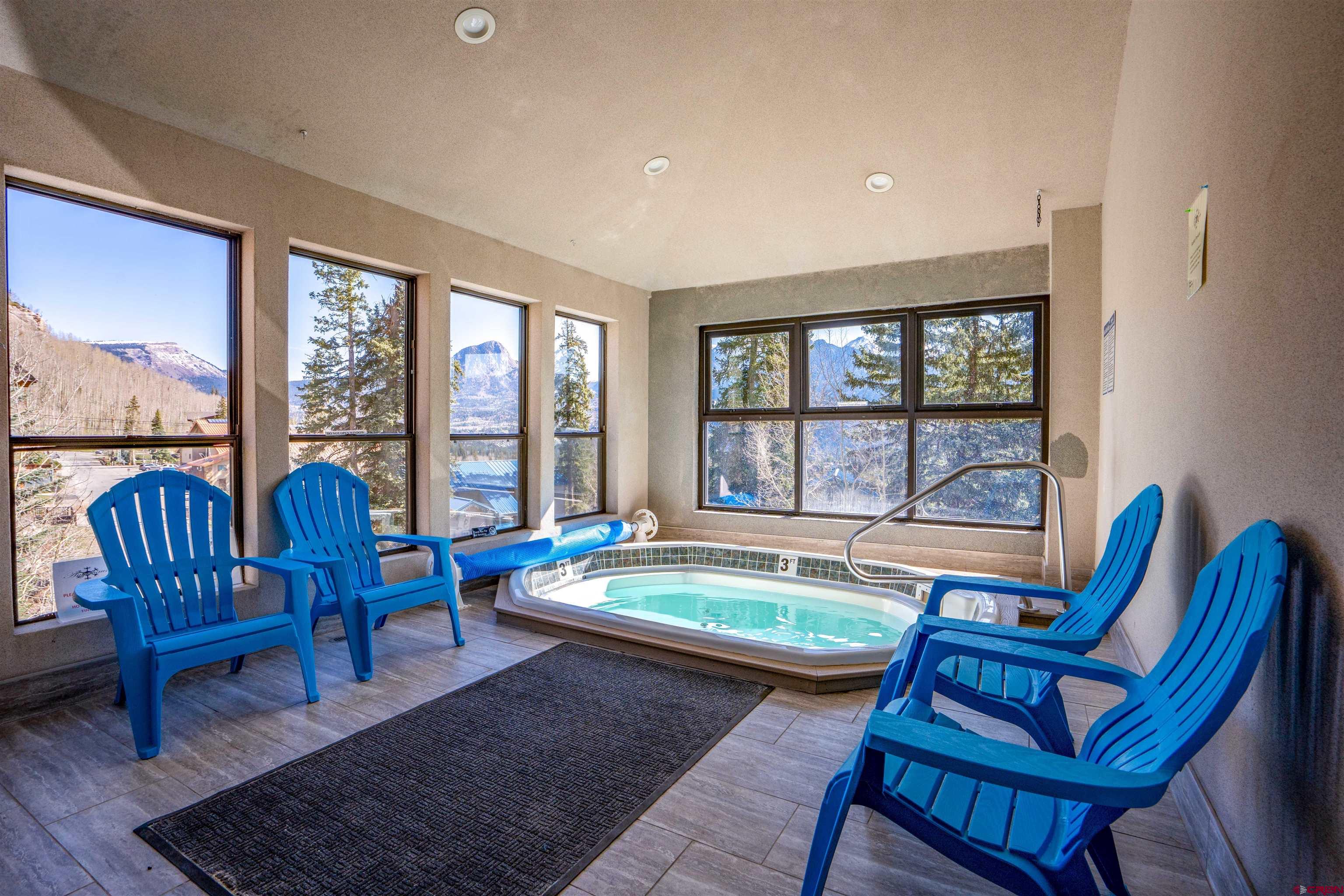 455 Sheol Street, Unit 320 Durango, CO 81301 - Photo 23 of 42 a living room with furniture and a floor to ceiling window