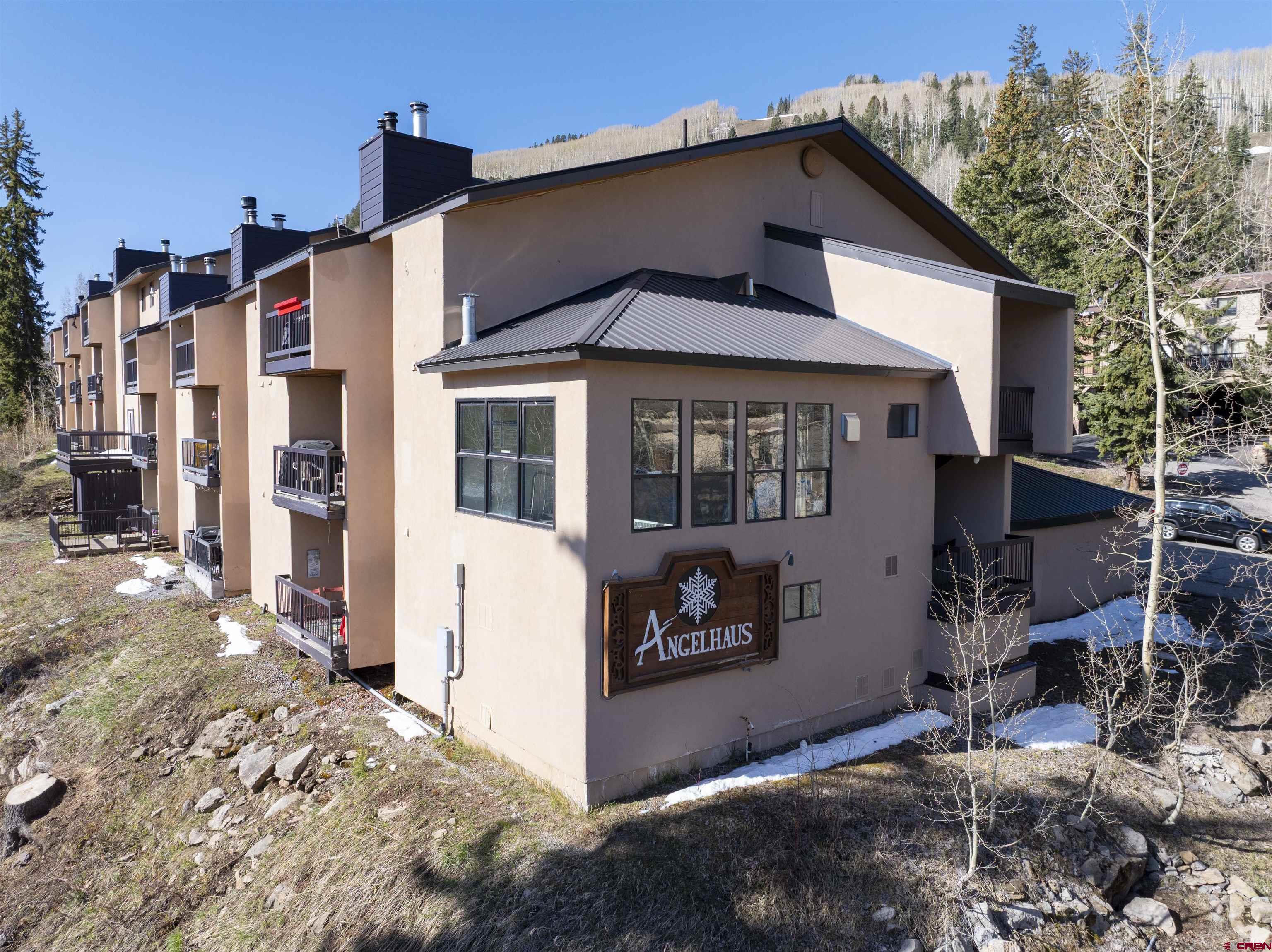 455 Sheol Street, Unit 320 Durango, CO 81301 - Photo 25 of 42 a front view of a house with a yard