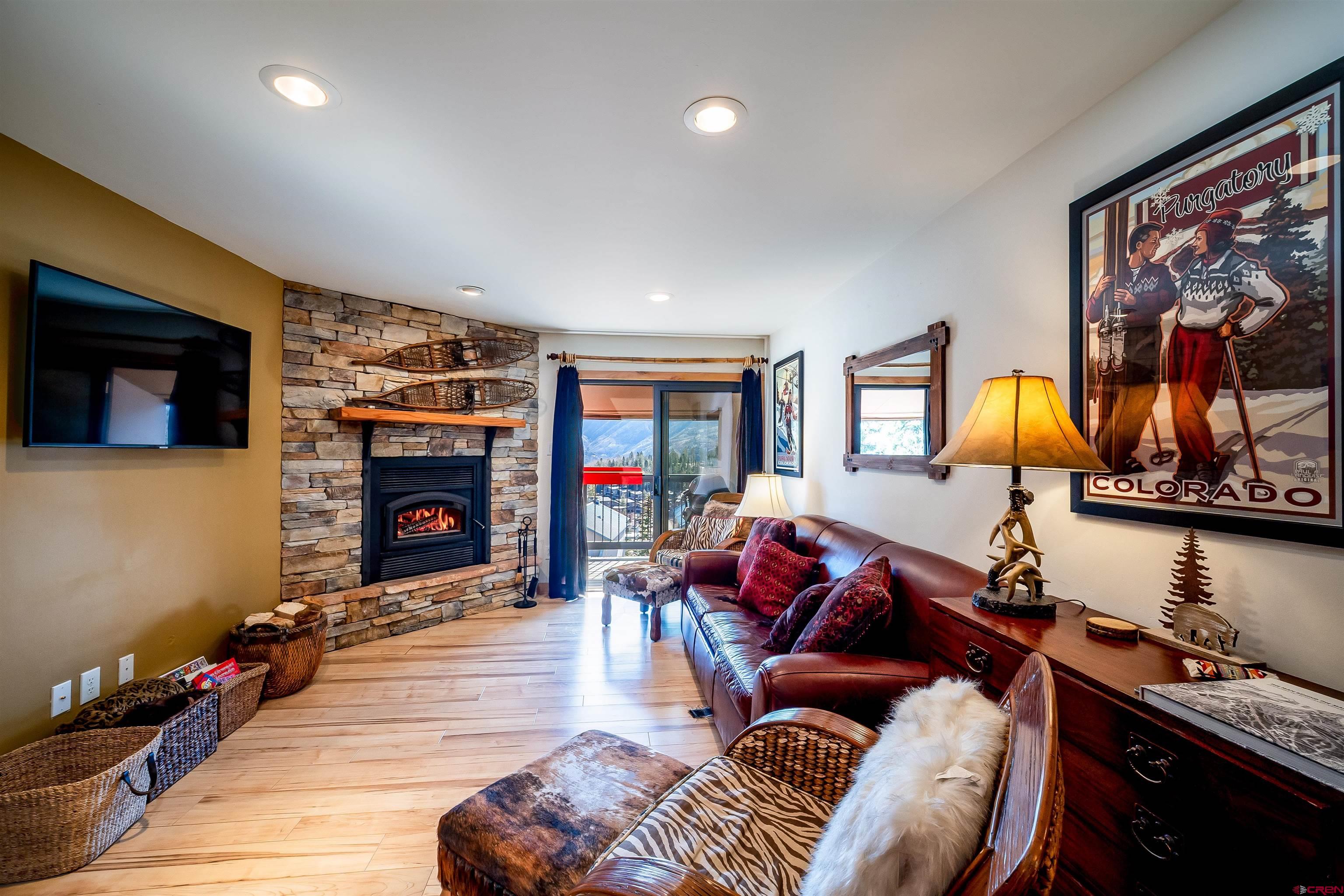 455 Sheol Street, Unit 320 Durango, CO 81301 - Photo 5 of 42 a living room with furniture and a fireplace