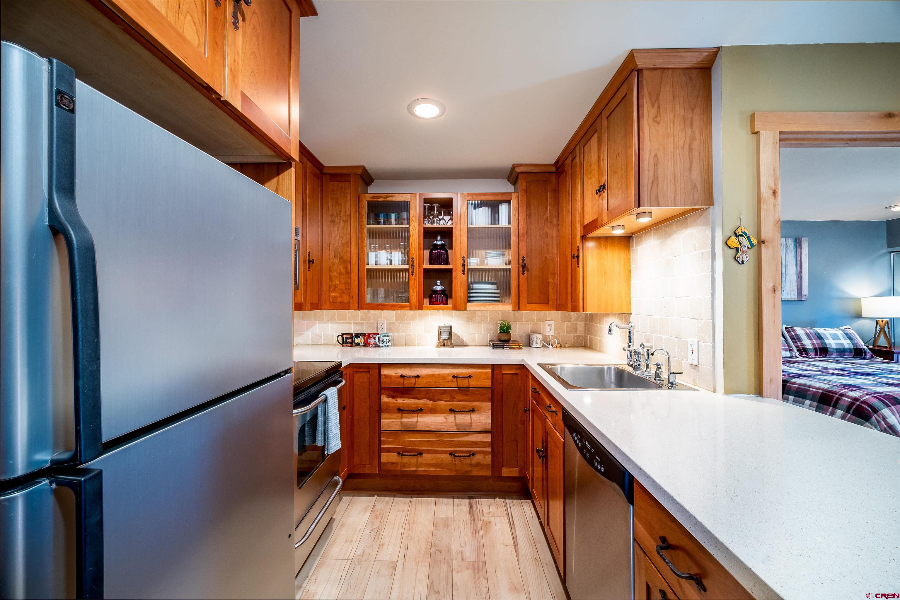 455 Sheol Street, Unit 320 Durango, CO 81301 - Photo 7 of 42 a kitchen with a sink stove and cabinets