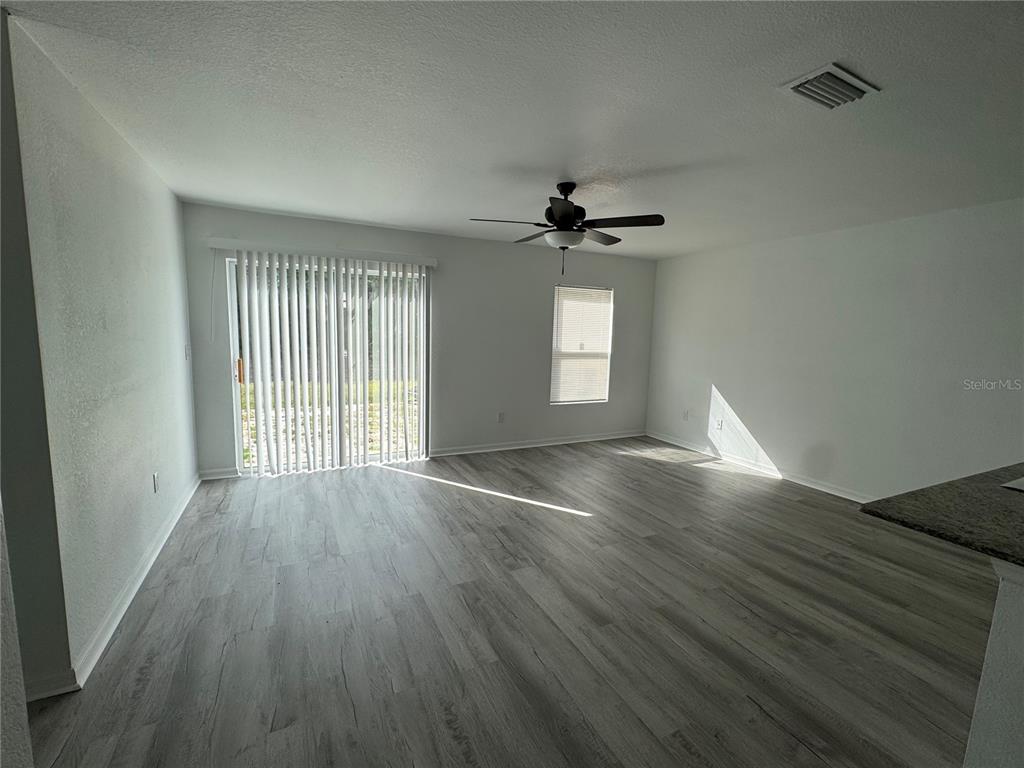 2173 Halblum Street North Port, FL 34288 - Photo 11 of 18 a view of an empty room with wooden floor and window