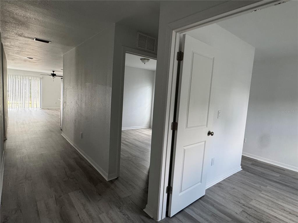2173 Halblum Street North Port, FL 34288 - Photo 4 of 18 a view of a hallway with wooden floor