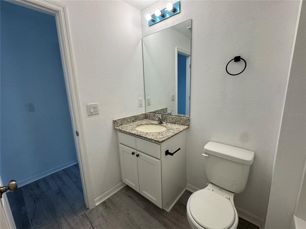 2173 Halblum Street North Port, FL 34288 - Photo 8 of 18 a bathroom with a toilet sink and mirror