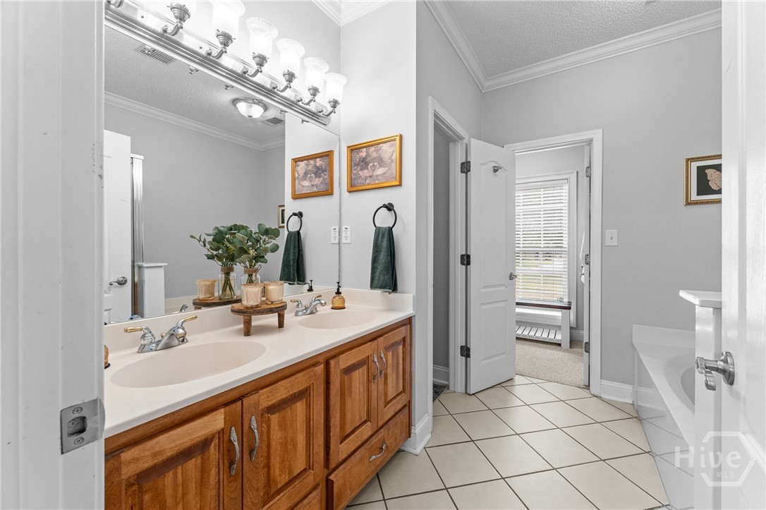 426 Peachtree Drive Rincon, GA 31326 - Photo 28 of 59 Main Bathroom ensuite with double vanity