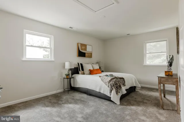 a bed room with a bed and a window