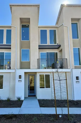 a front view of a house with glass windows