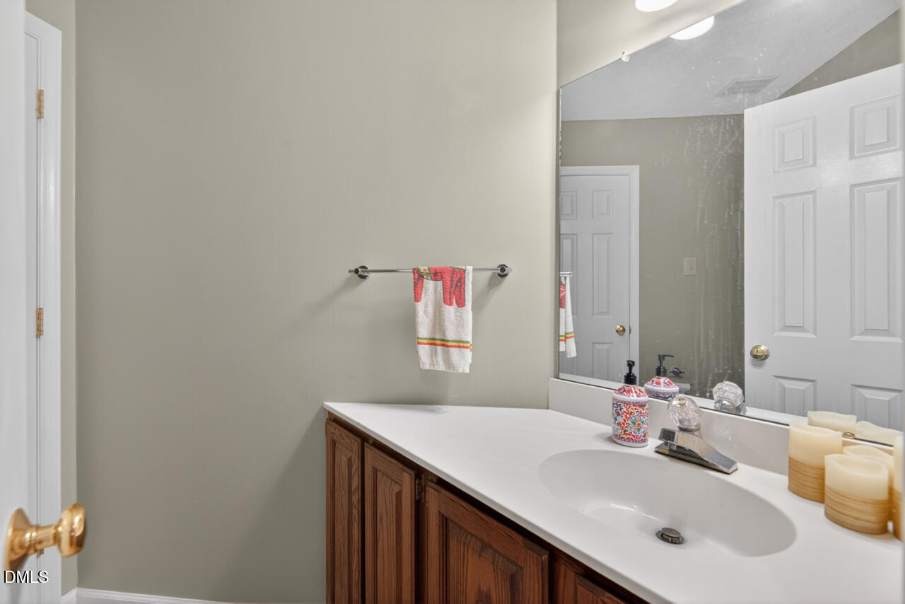 3307 Coachman's Way Durham, NC 27705 - Photo 26 of 50 a bathroom with a sink and a mirror