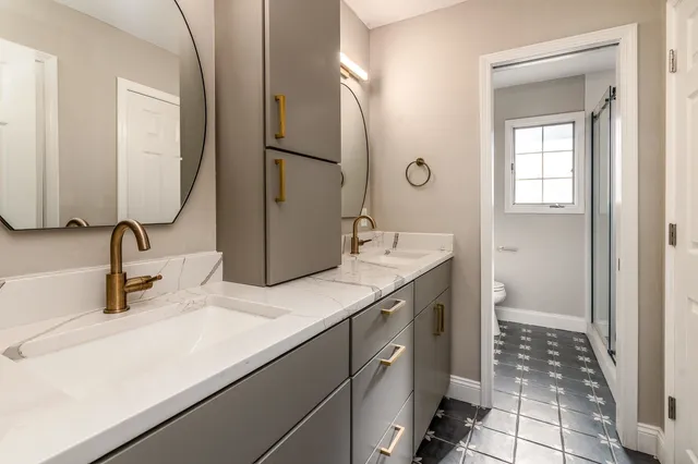 a bathroom with a sink and a mirror