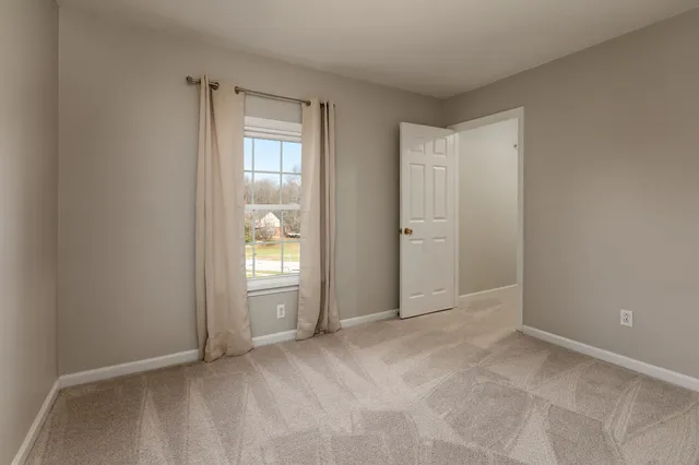 a view of an empty room with window