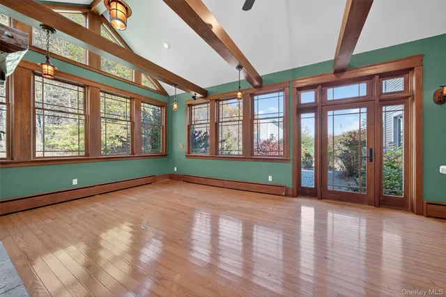a view of an empty room with a large window