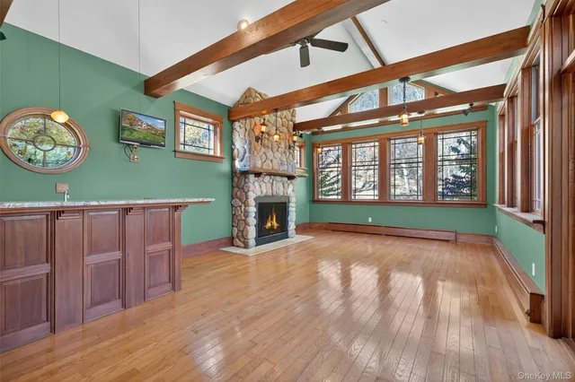 a view of a living room and a fireplace