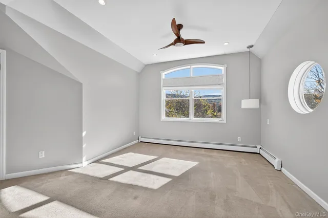 a bathroom with a tub a sink and mirror