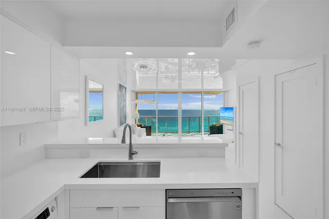 a kitchen with a sink and a window