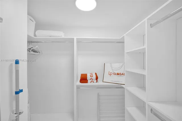 a utility room with shower and vanity