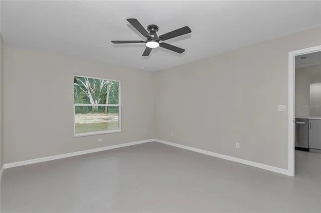 a view of bathroom with a toilet sink and a mirror