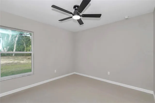 view of a brick house with a bench