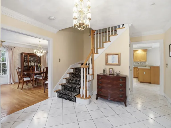 a view of a livingroom with furniture and stairs