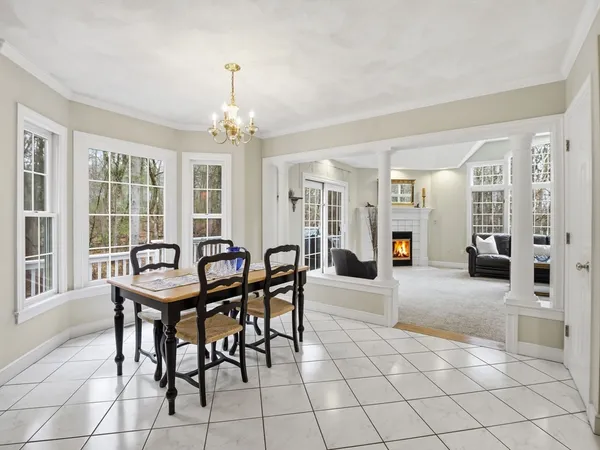 a dining room with furniture and window