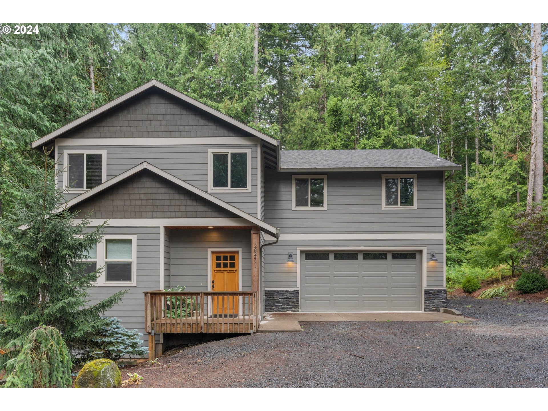 28247 South Moonridge Road Colton, OR 97017 - Photo 1 of 27 a front view of a house with a garden