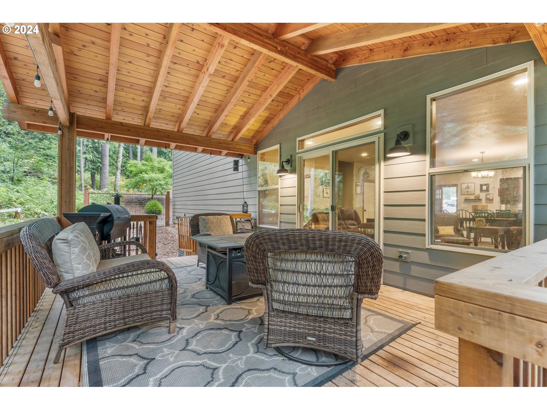 28247 South Moonridge Road Colton, OR 97017 - Photo 23 of 27 a living room with furniture a wooden floor and next to a window
