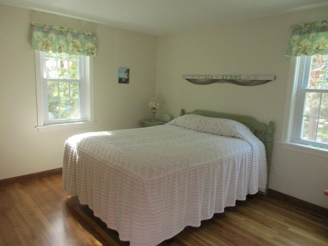 4 Stage Coach Road Harwich, MA 02645 - Photo 14 of 34 a bed sitting in a bedroom next to a window