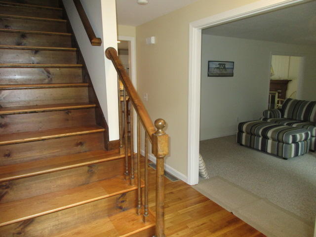 4 Stage Coach Road Harwich, MA 02645 - Photo 16 of 34 a view of staircase with white walls and railing