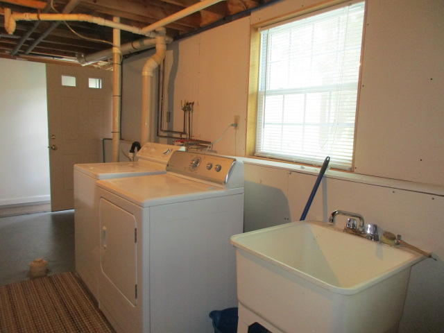 4 Stage Coach Road Harwich, MA 02645 - Photo 19 of 34 a bathroom with a sink and a bathtub