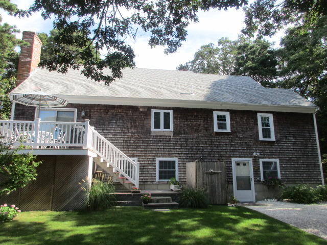 4 Stage Coach Road Harwich, MA 02645 - Photo 2 of 34 a aerial view of a house with a yard and a large tree