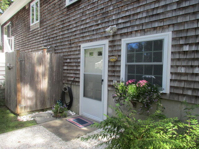 4 Stage Coach Road Harwich, MA 02645 - Photo 26 of 34 a front view of a house with a yard