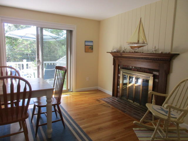 4 Stage Coach Road Harwich, MA 02645 - Photo 9 of 34 a view of a livingroom with furniture and a fireplace