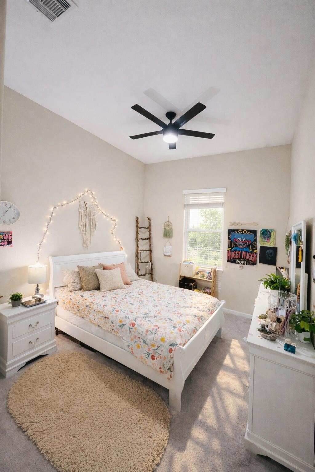 4334 Redford Valley Road Rosharon, TX 77583 - Photo 14 of 44 a bedroom with a large bed and a chandelier