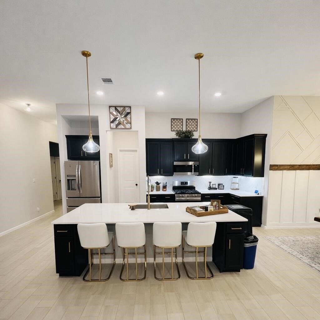 4334 Redford Valley Road Rosharon, TX 77583 - Photo 21 of 44 a large kitchen with a table and chairs