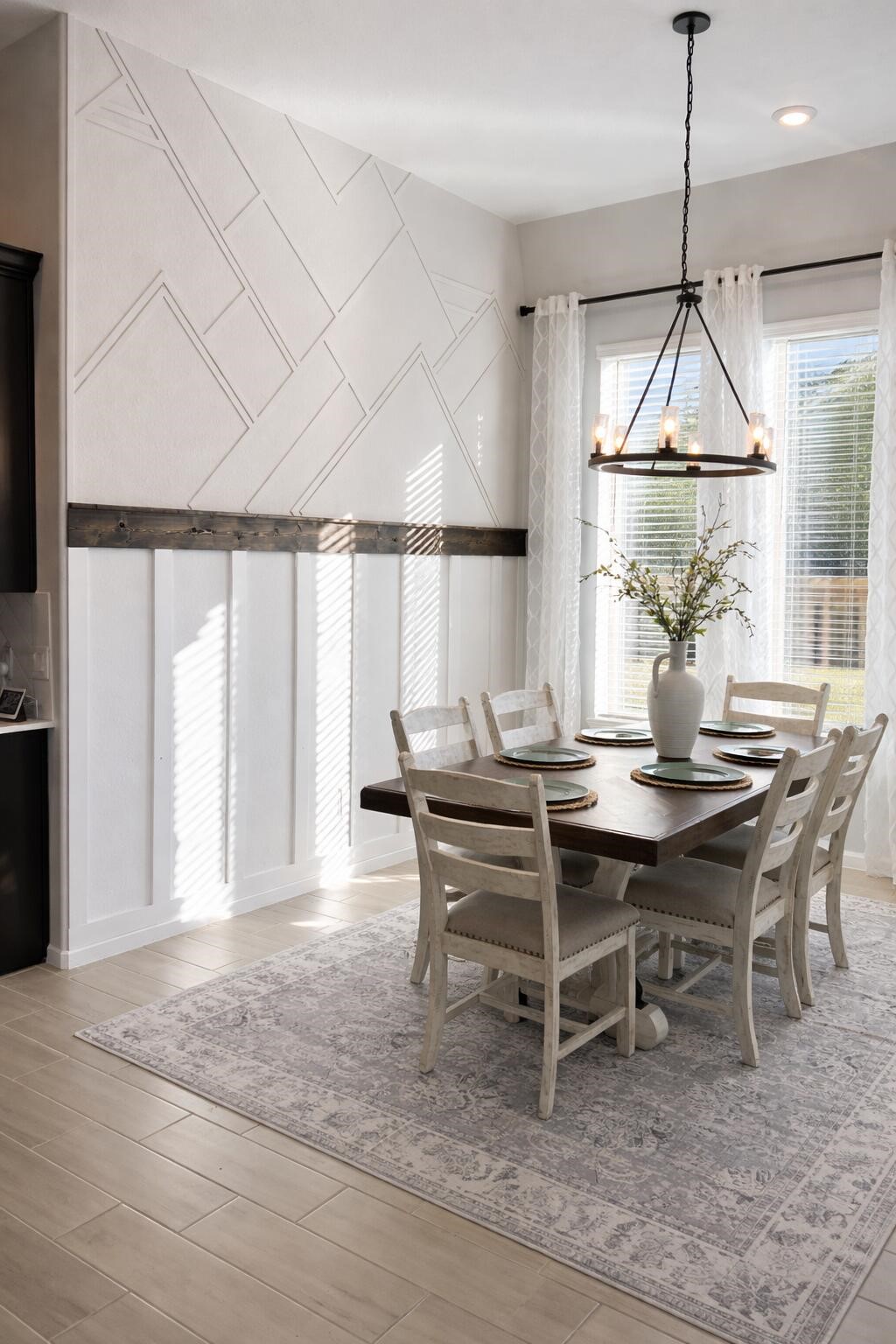 4334 Redford Valley Road Rosharon, TX 77583 - Photo 25 of 44 a dining room with wooden floor and a chandelier