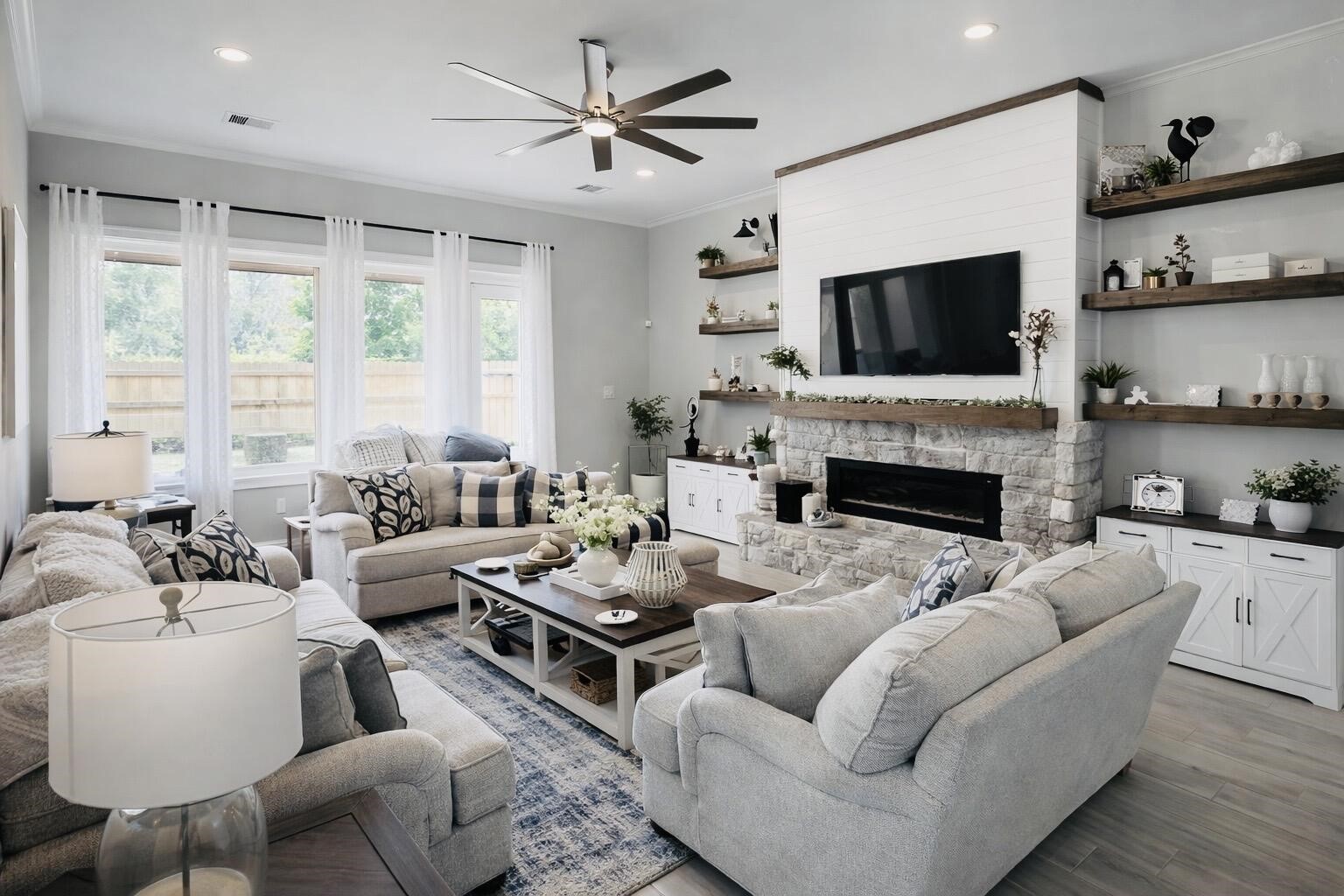 4334 Redford Valley Road Rosharon, TX 77583 - Photo 29 of 44 a living room with furniture fireplace and a flat screen tv