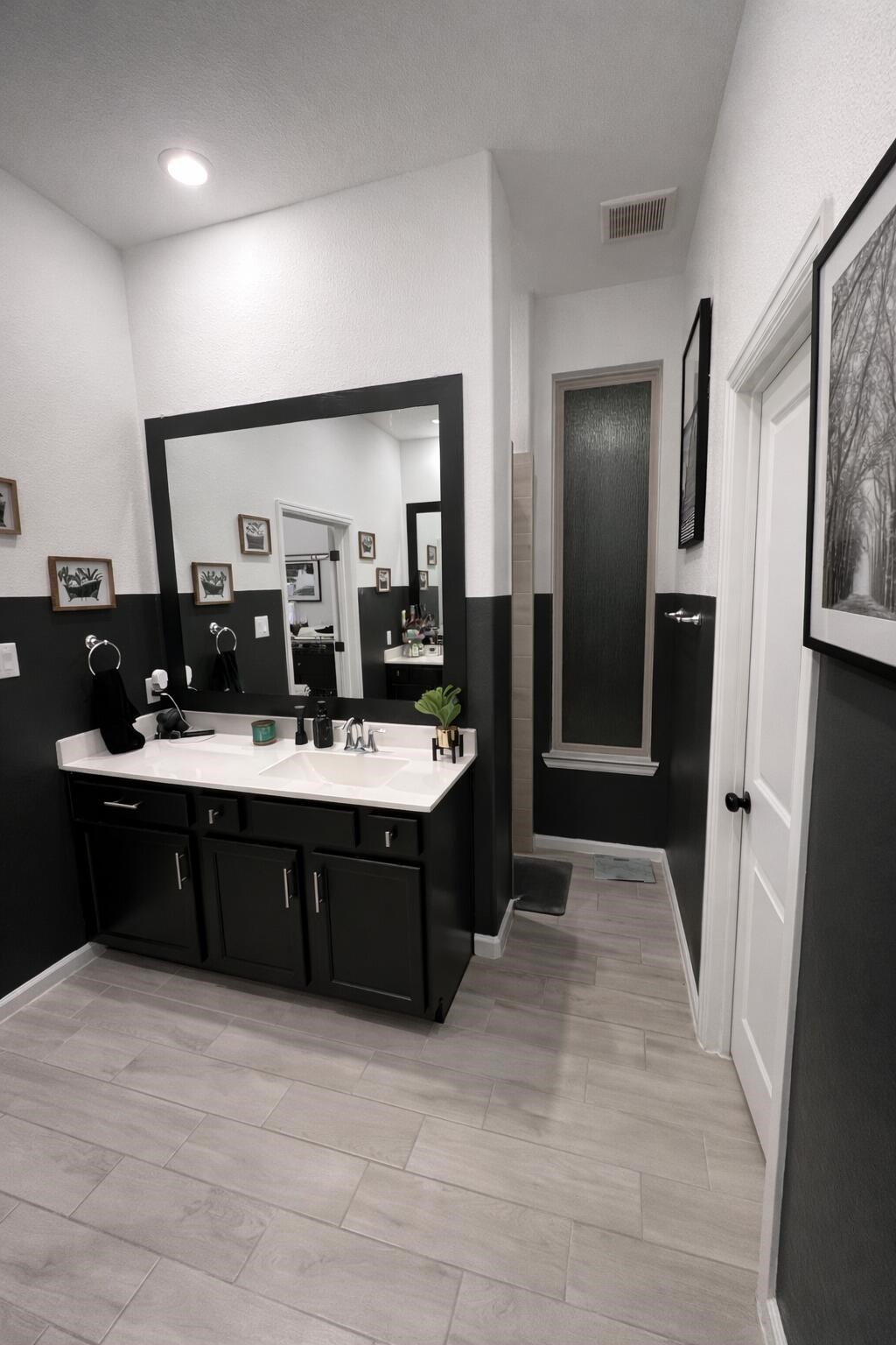 4334 Redford Valley Road Rosharon, TX 77583 - Photo 37 of 44 a bathroom with a sink vanity granite tub shower and a mirror