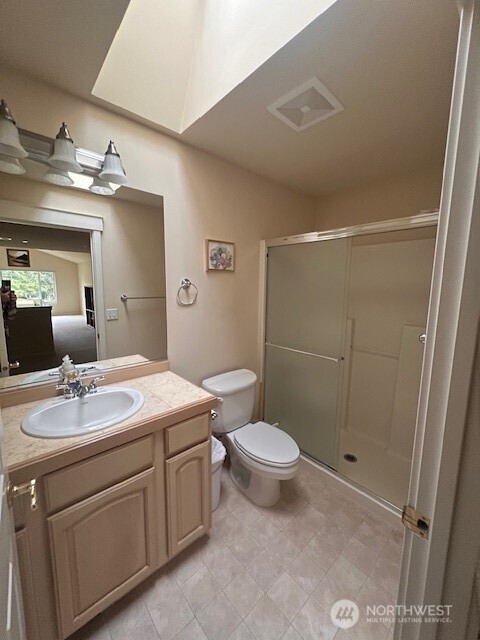160 East Soderberg Road, Unit H23 Allyn, WA 98524 - Photo 14 of 20 a bathroom with a sink a toilet and shower