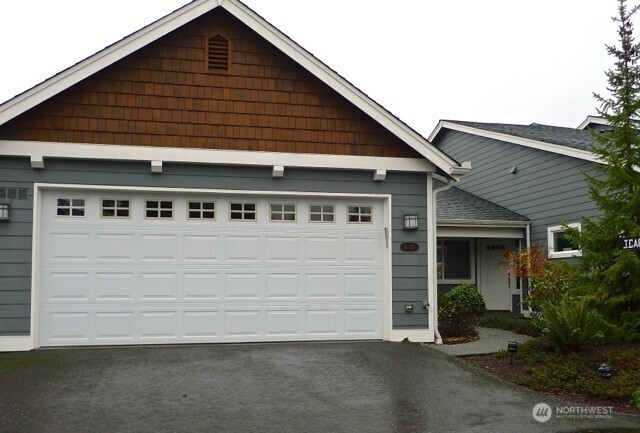 160 East Soderberg Road, Unit H23 Allyn, WA 98524 - Photo 15 of 20 a front view of a house with garage