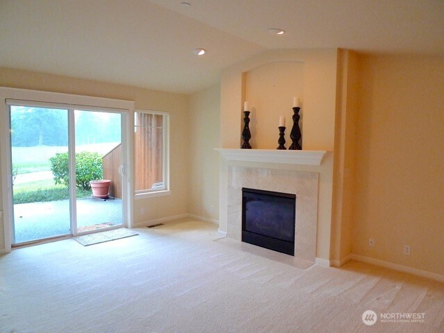160 East Soderberg Road, Unit H23 Allyn, WA 98524 - Photo 7 of 20 a living room with furniture and a fireplace