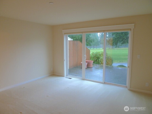 160 East Soderberg Road, Unit H23 Allyn, WA 98524 - Photo 9 of 20 a view of a room with a large window